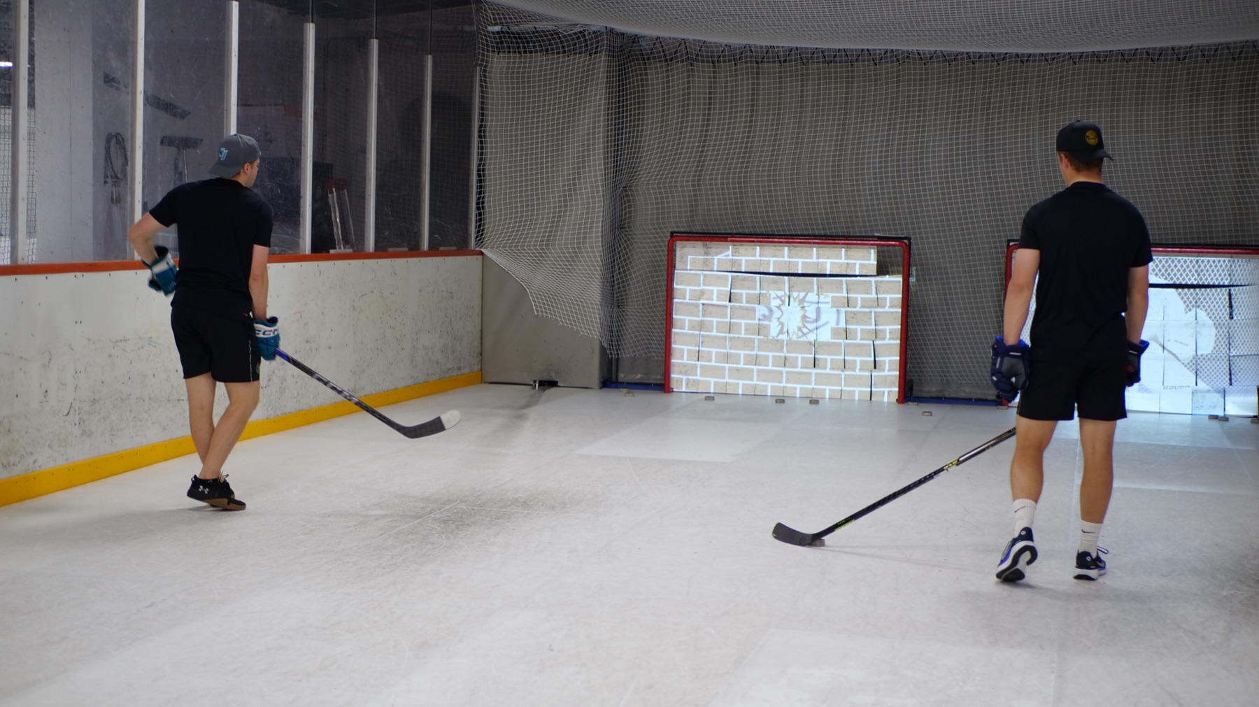 Players practising shots at interactive targets