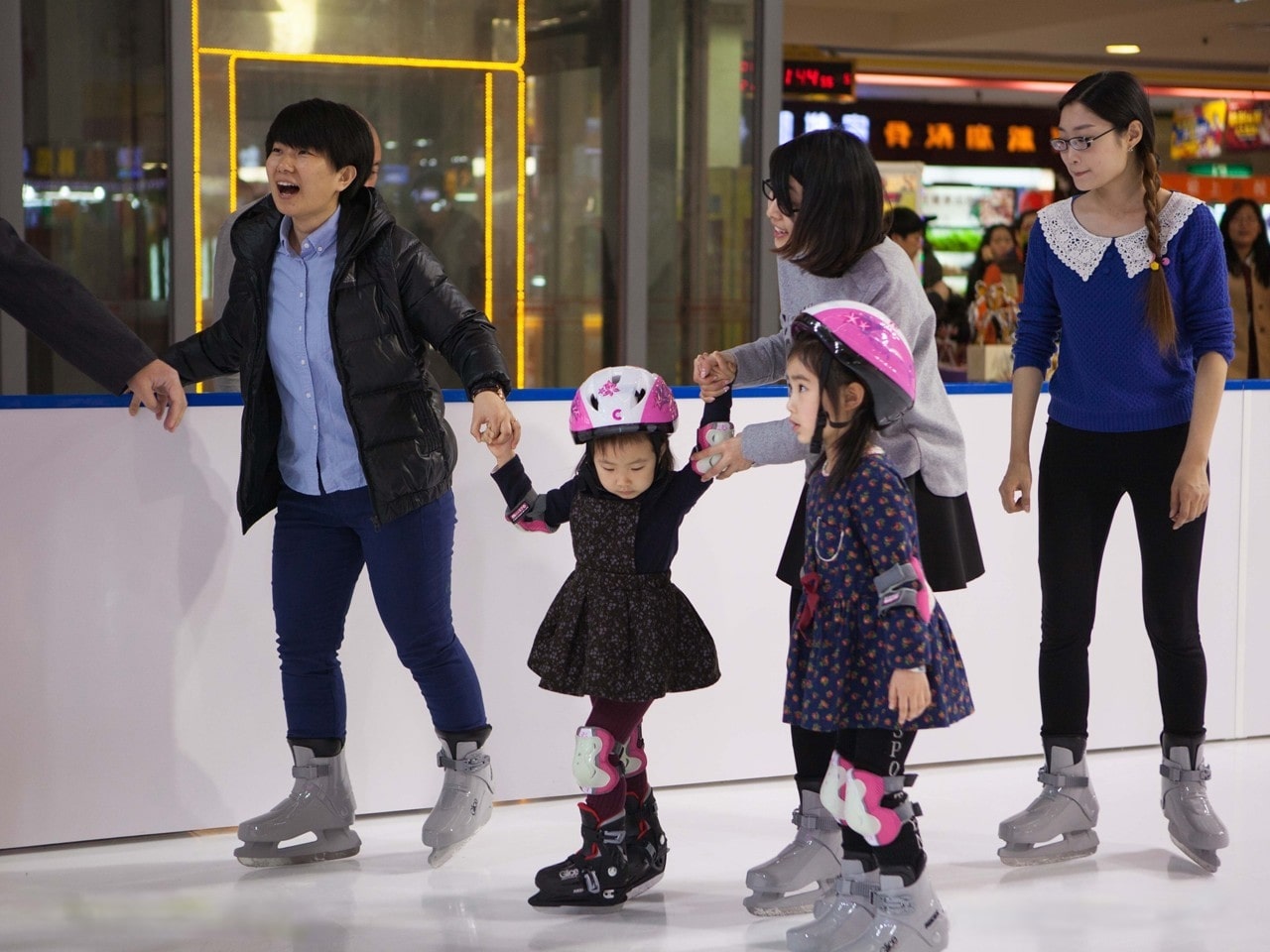 Family skating on ice